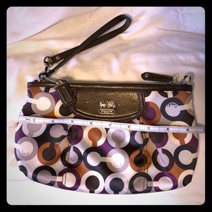 Coach multicolored wristlet w/ brown leather trim